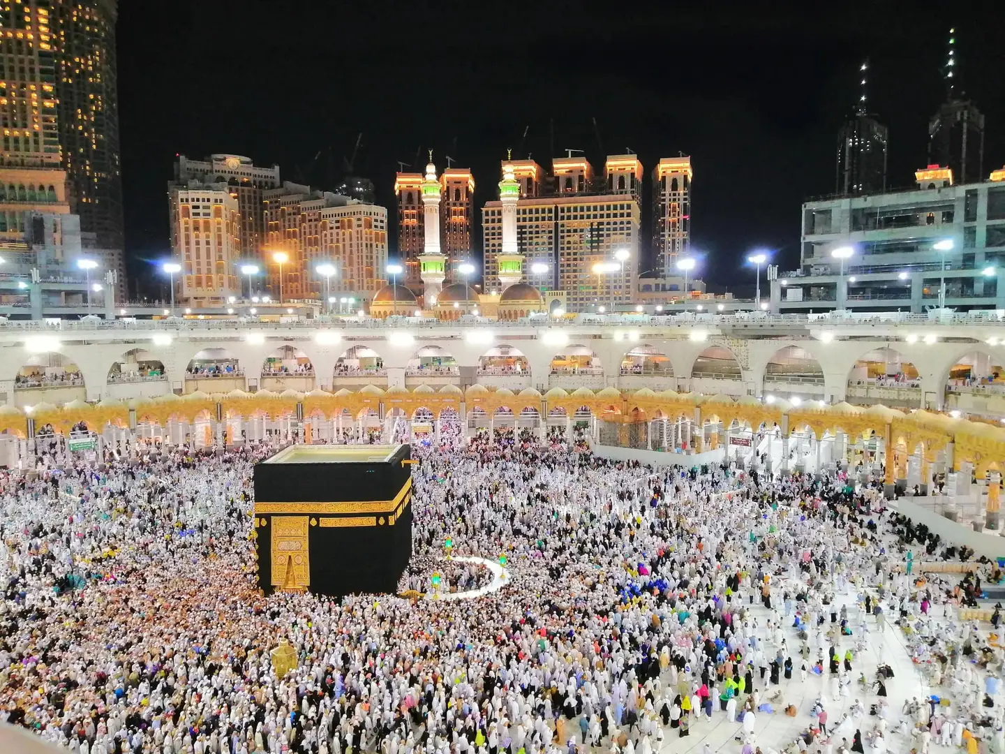 Al-Masjid al-Haram illuminated at night as pilgrims circle the Holy Kaaba in Makkah